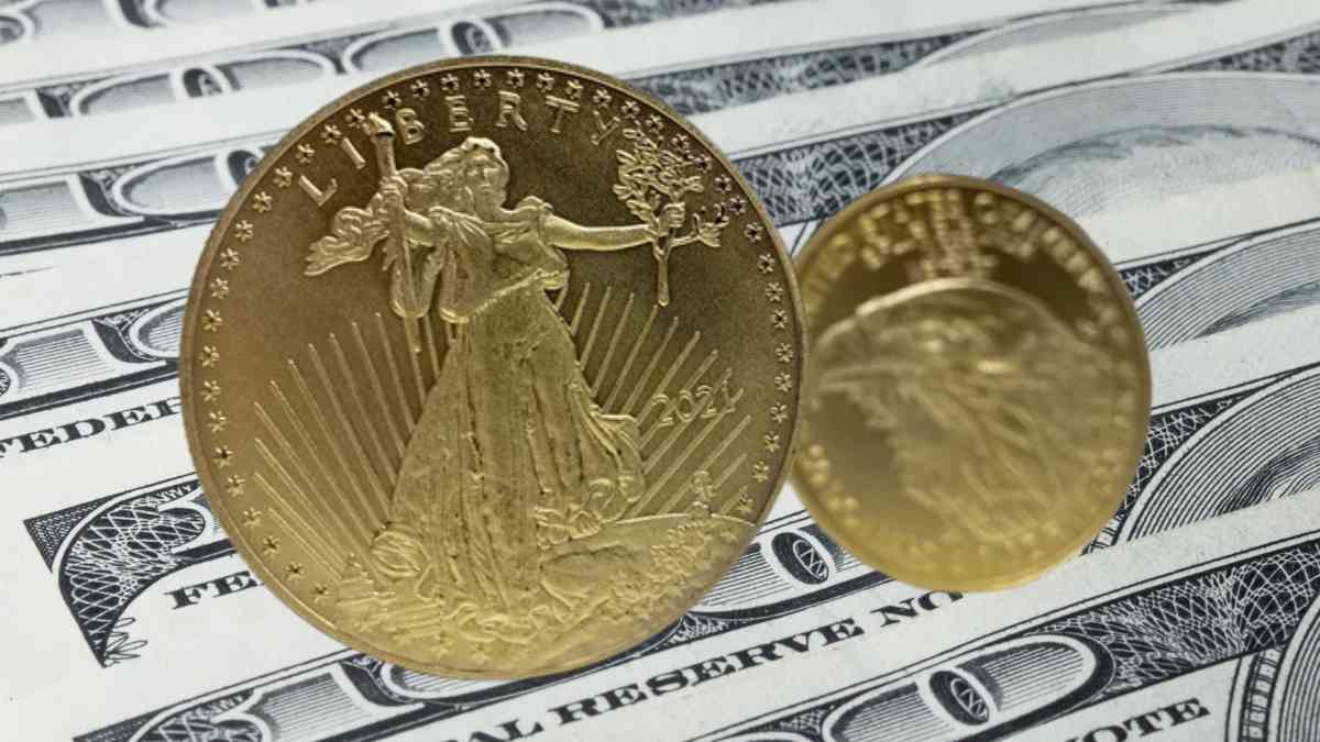 Gold coin on dollar bills representing a rare coin valued at $3.9 million at auction, an emblematic numismatic piece.