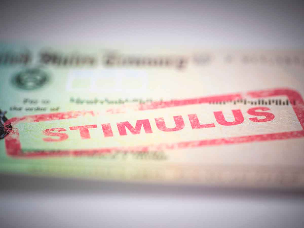 Close-up of a U.S. Treasury check stamped “STIMULUS,” symbolizing the $1,702 Alaska Permanent Fund Dividend payment due May 15 2025