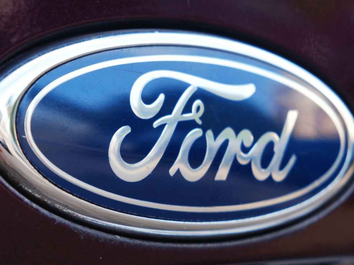 Close-up of the Ford logo on the front grille of a vehicle involved in the 2025 SUV recall