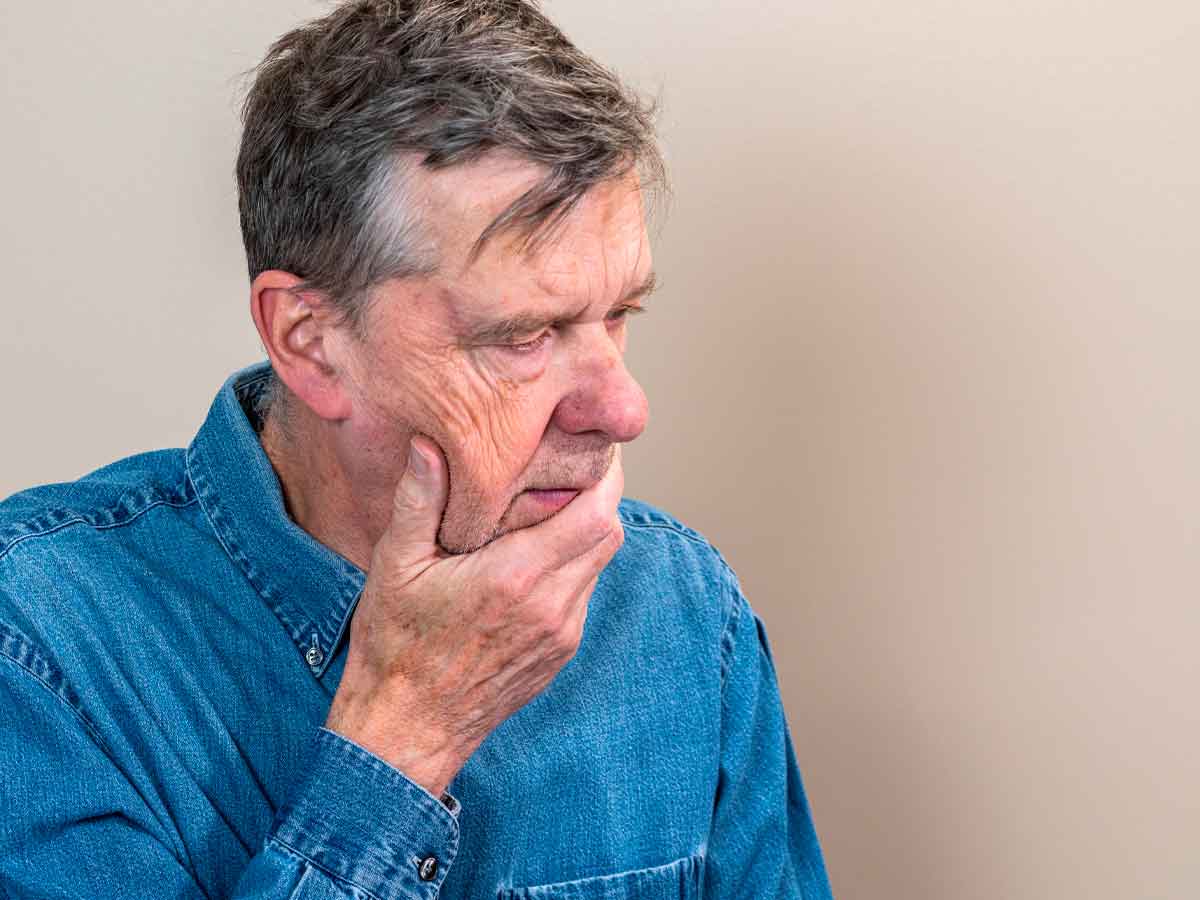 Thoughtful senior man pondering rising life expectancy and new retirement-age rules