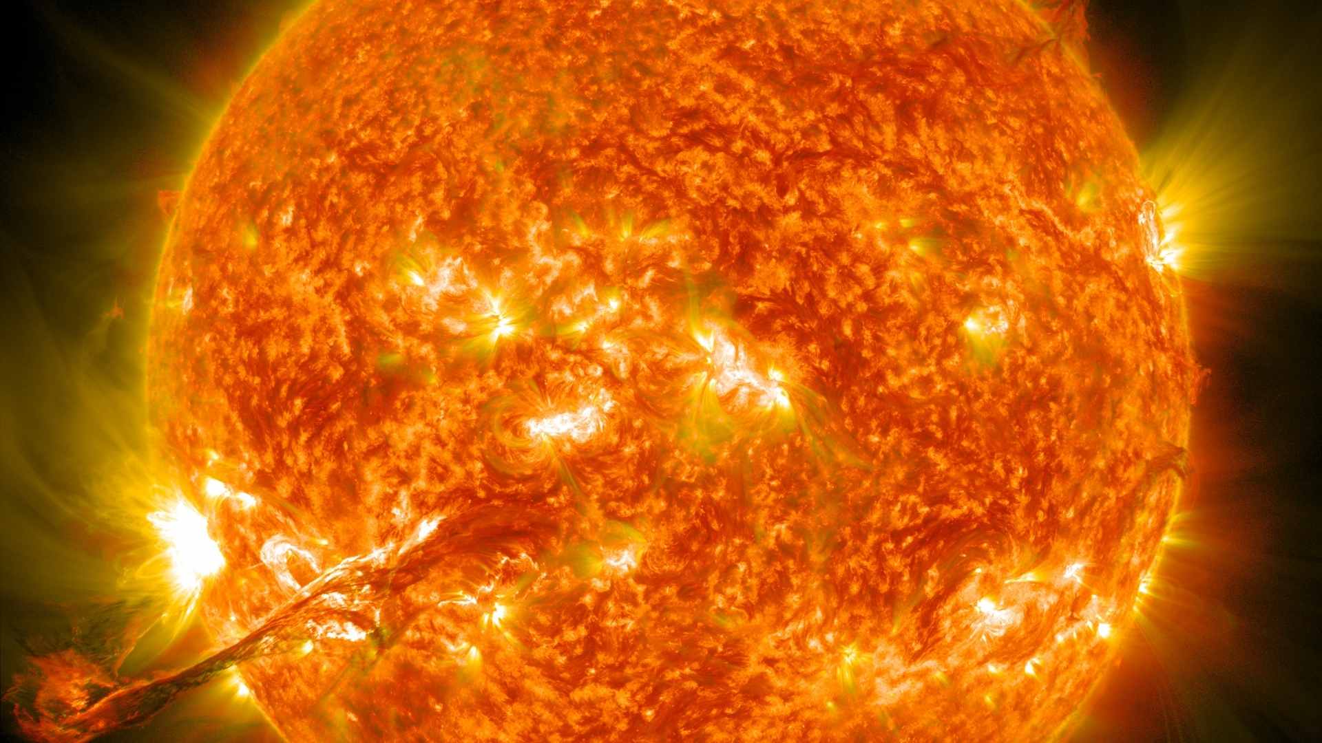 High-resolution image of the sun highlighting a 500,000-mile coronal hole and intense solar flare activity
