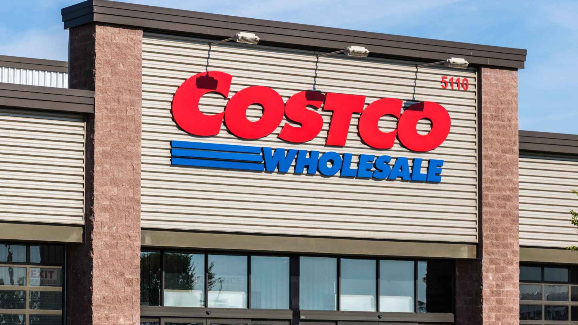 Exterior view of a Costco Wholesale storefront with its red and blue logo.