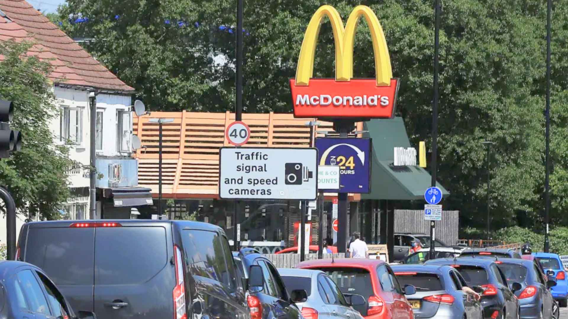 Cars queue outside a McDonald’s drive-thru as crowds rush to grab the returning Squishmallows Happy Meal after a two-year wait.