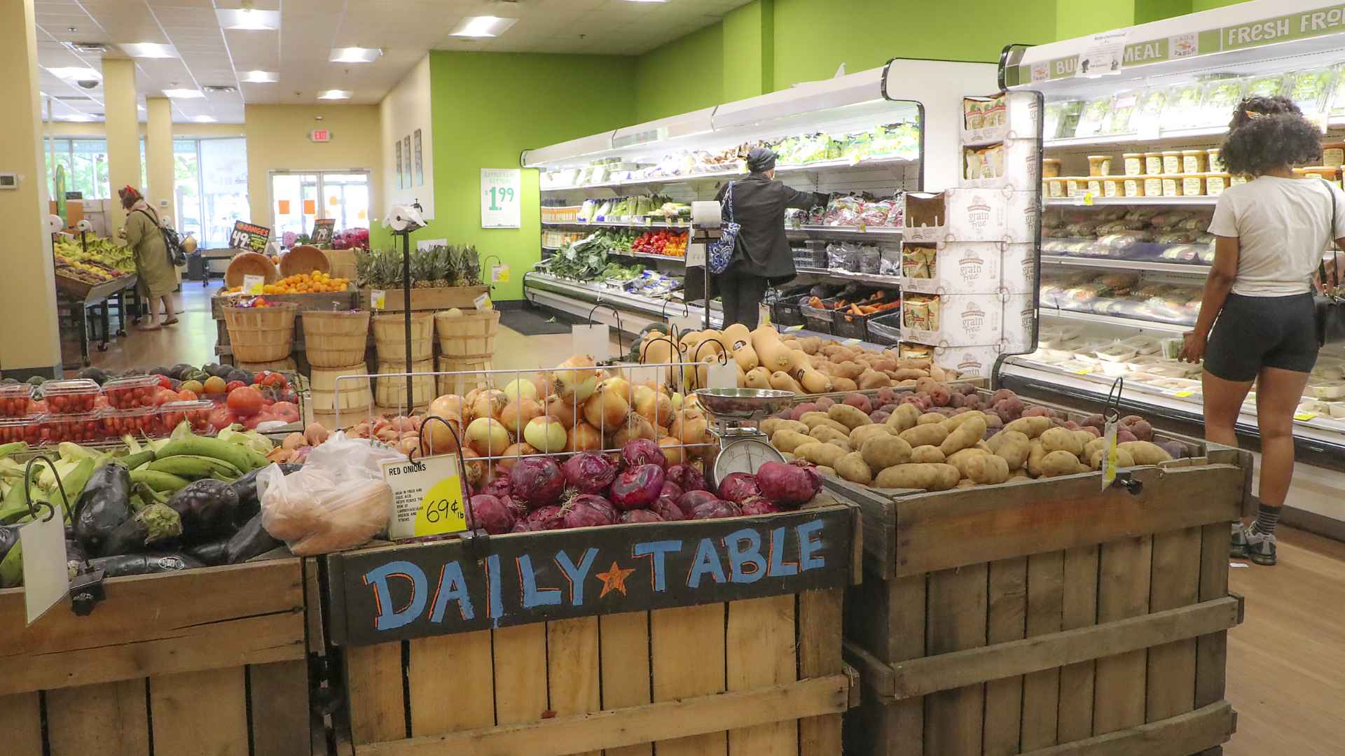 Shoppers selecting fresh produce inside a Daily Table supermarket ahead of the chain’s complete closure scheduled for this summer.