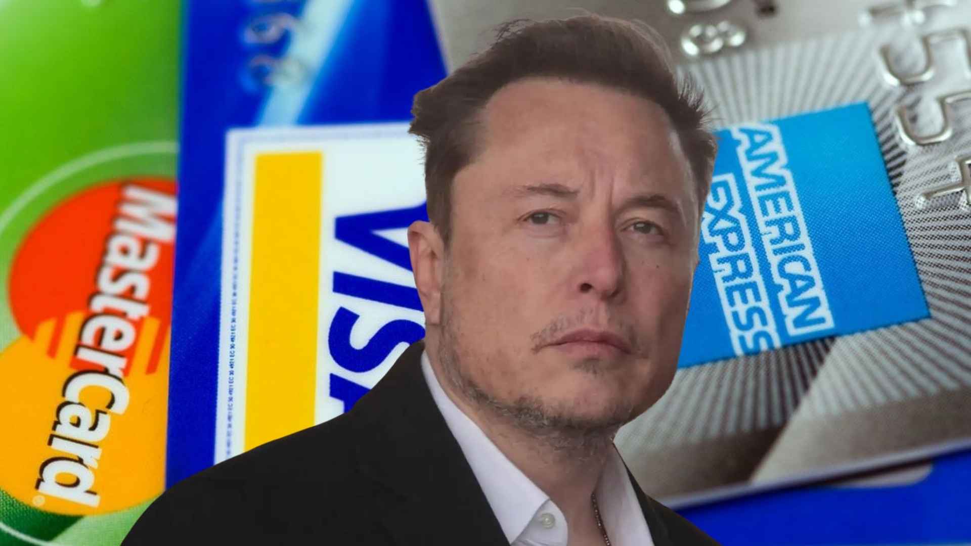 Serious business executive in suit with Mastercard, Visa and American Express cards blurred in background