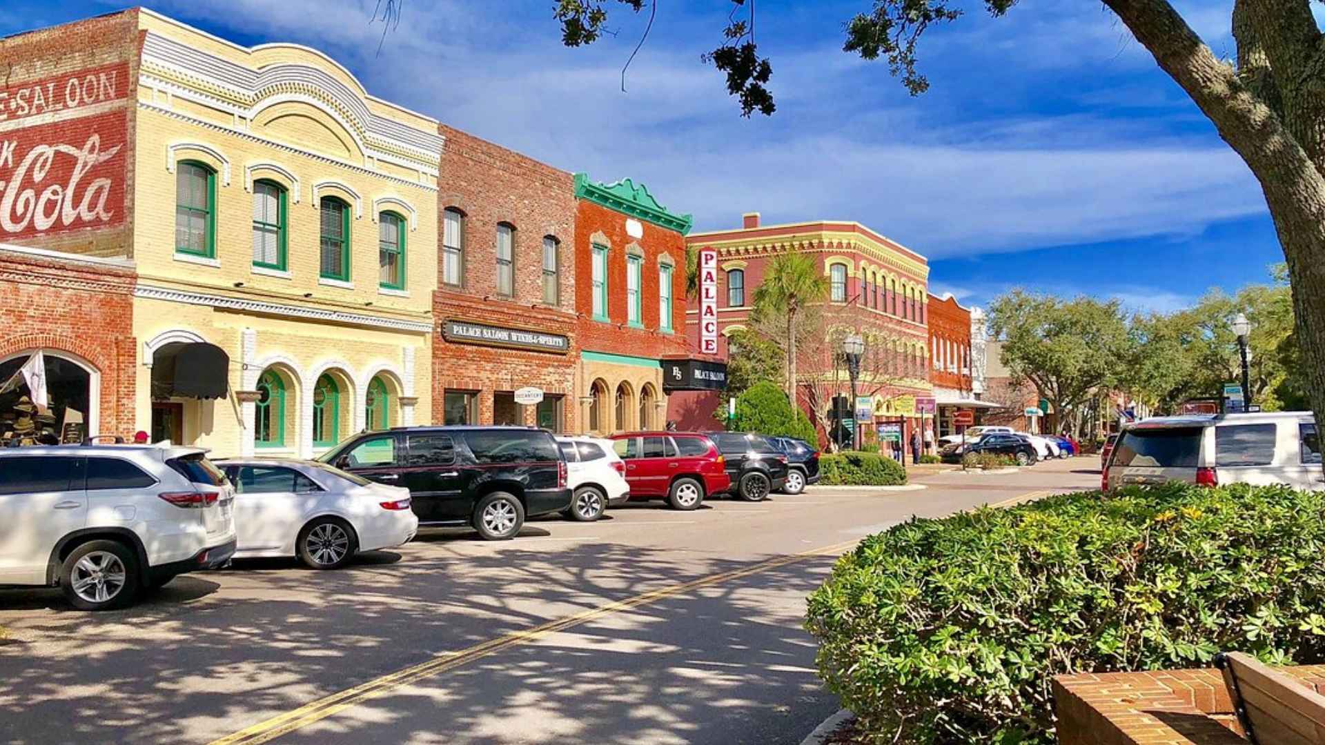 Colorful brick storefronts along Centre Street in Fernandina Beach, Fla., where residents turn to local shops during Winn-Dixie and Publix closures.