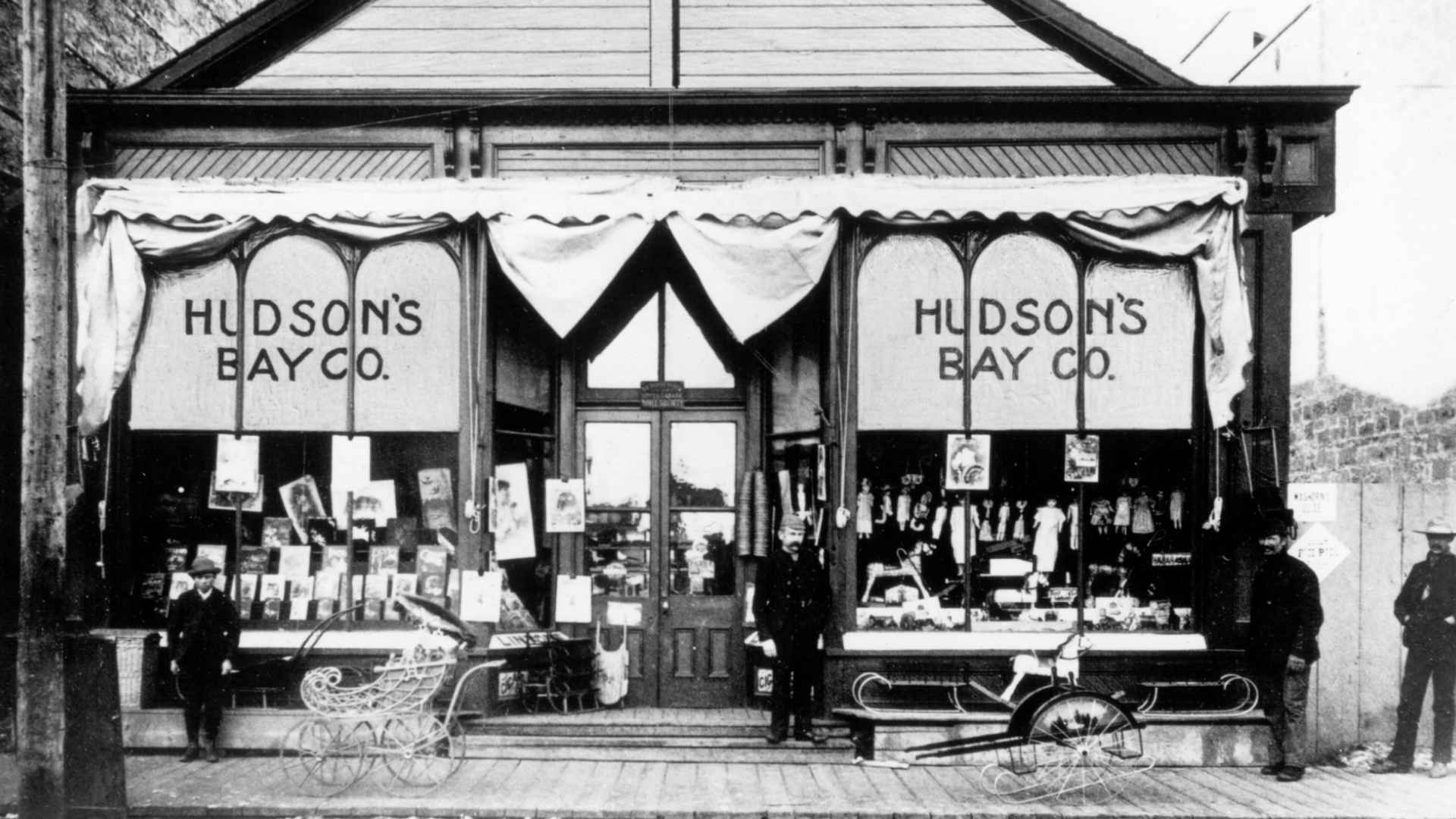 Historic Hudson Bay company storefront early 1900s with window displays and shoppers ahead of 355-year liquidation