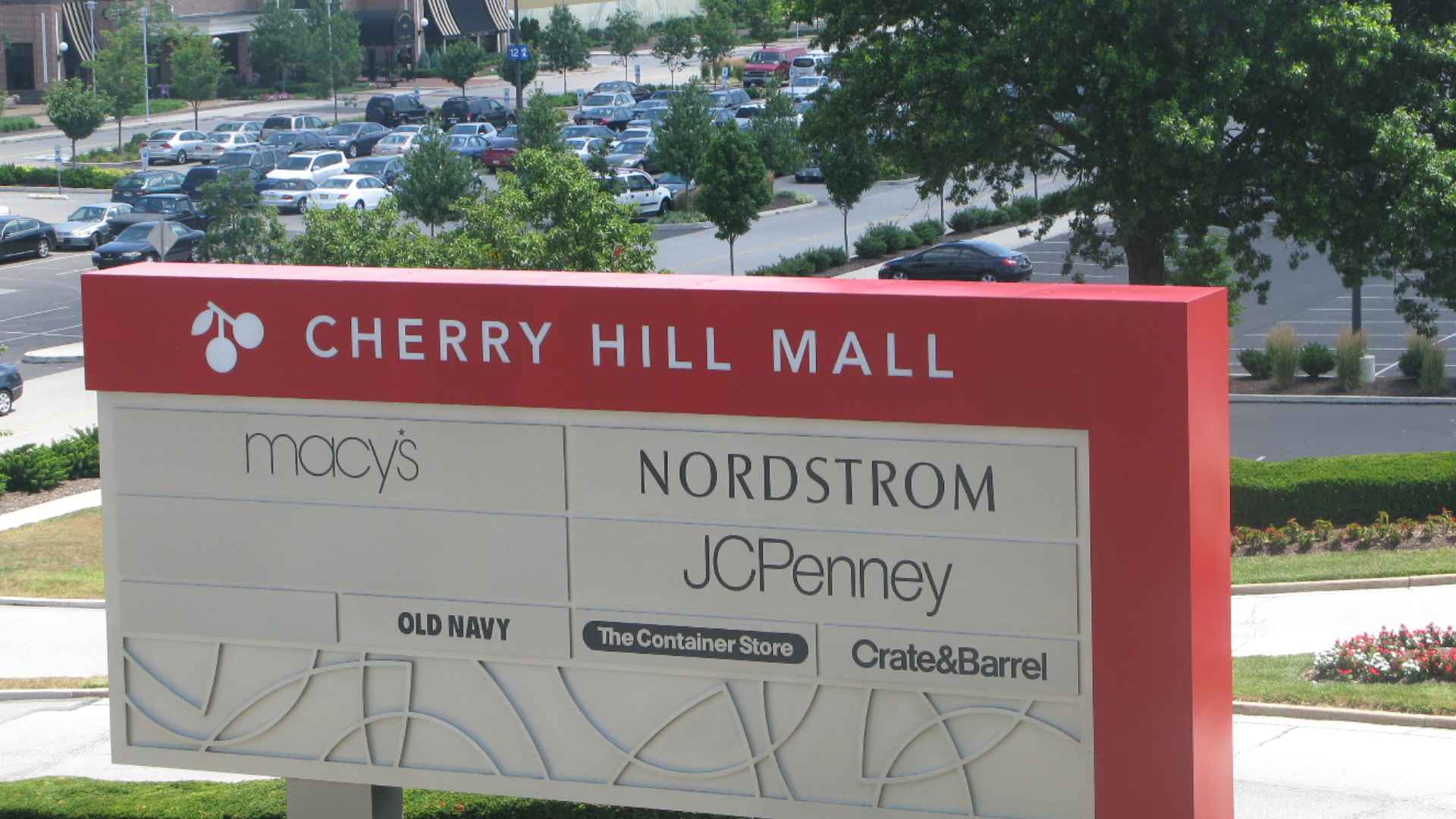 Cherry Hill Mall entrance sign with red header and list of anchor stores including Macy’s, Nordstrom, JCPenney, Old Navy, Crate & Barrel.