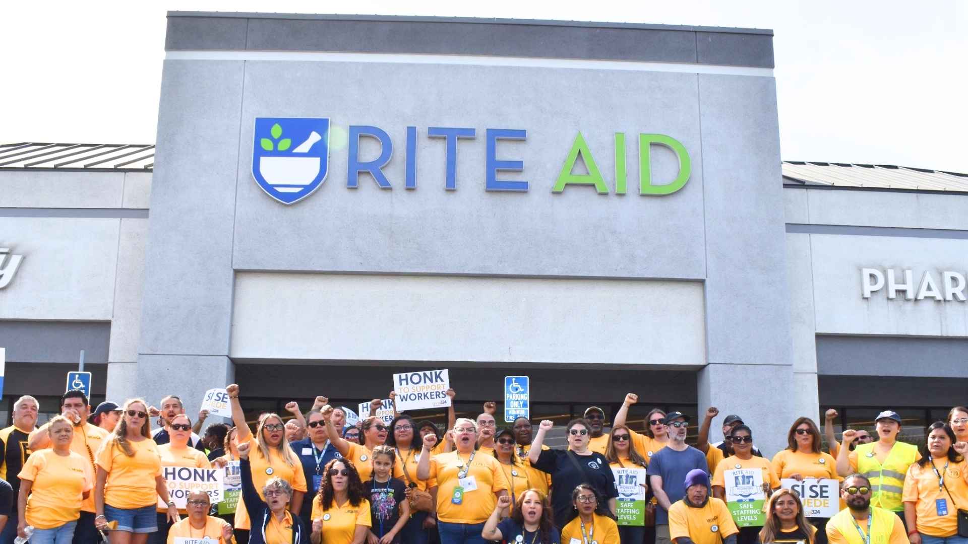 Rite Aid employees in yellow shirts protest outside Philadelphia store after second bankruptcy triggers nearly 600 layoffs
