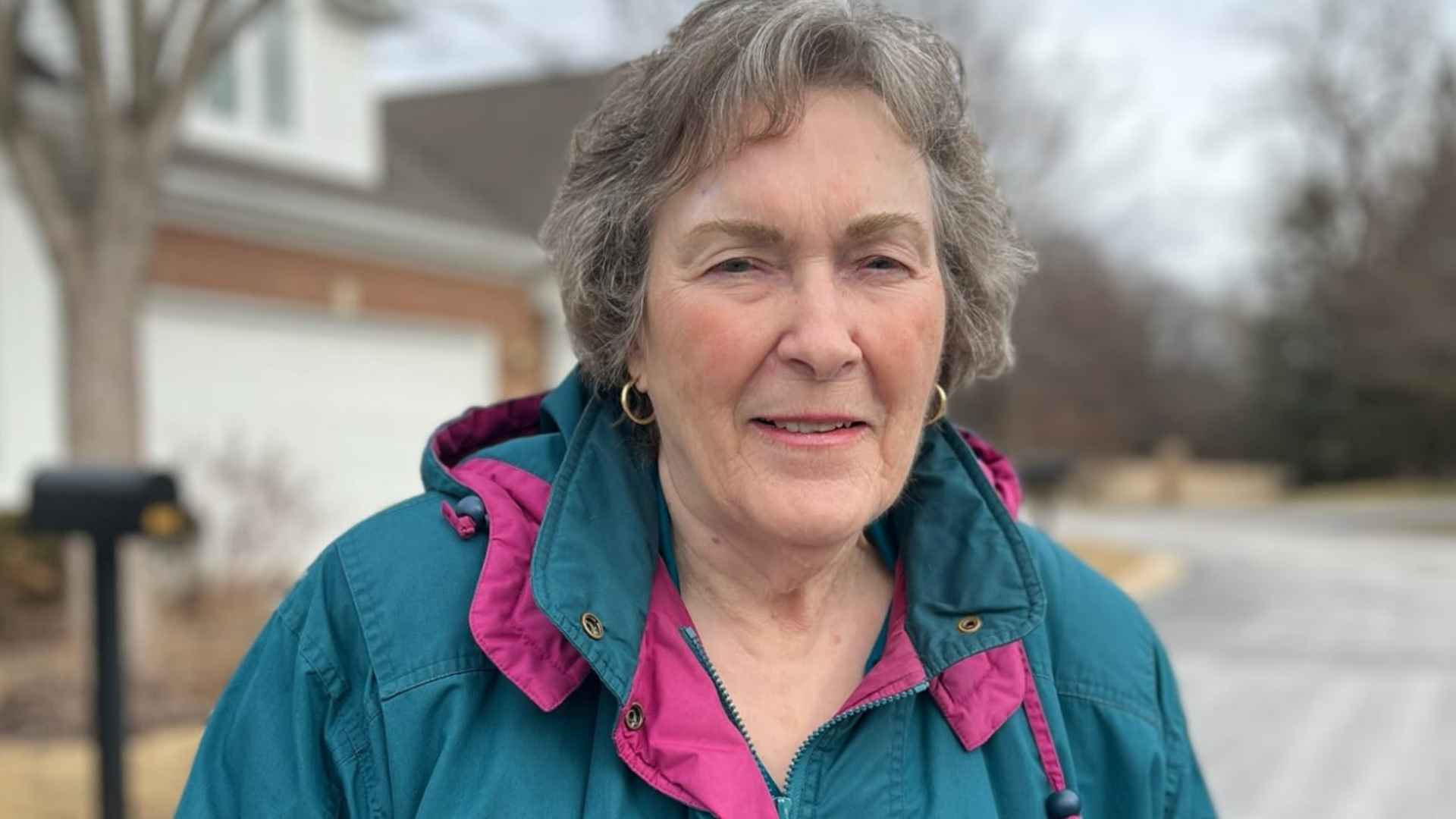84-year-old Vietnam veteran standing outside her Illinois senior community after 365 percent rent hike