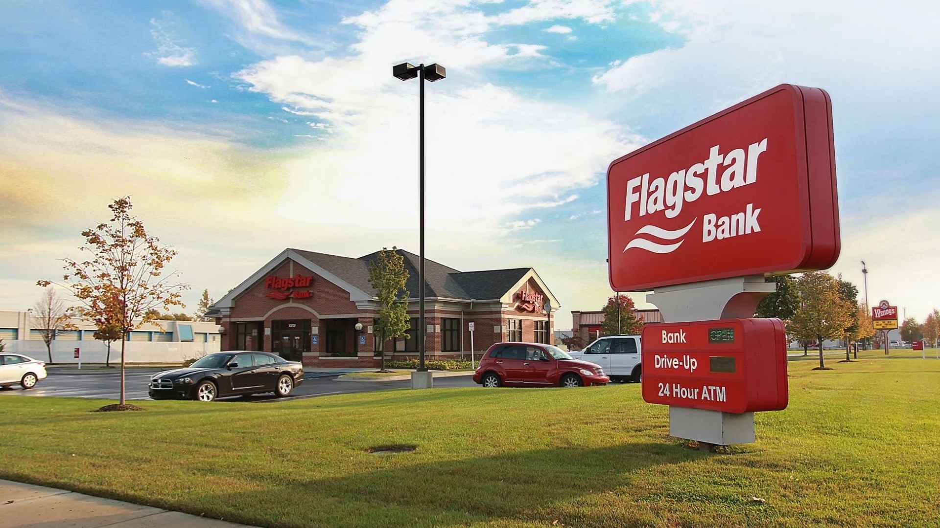 Flagstar Bank branch exterior with drive-up window and 24-hour ATM sign