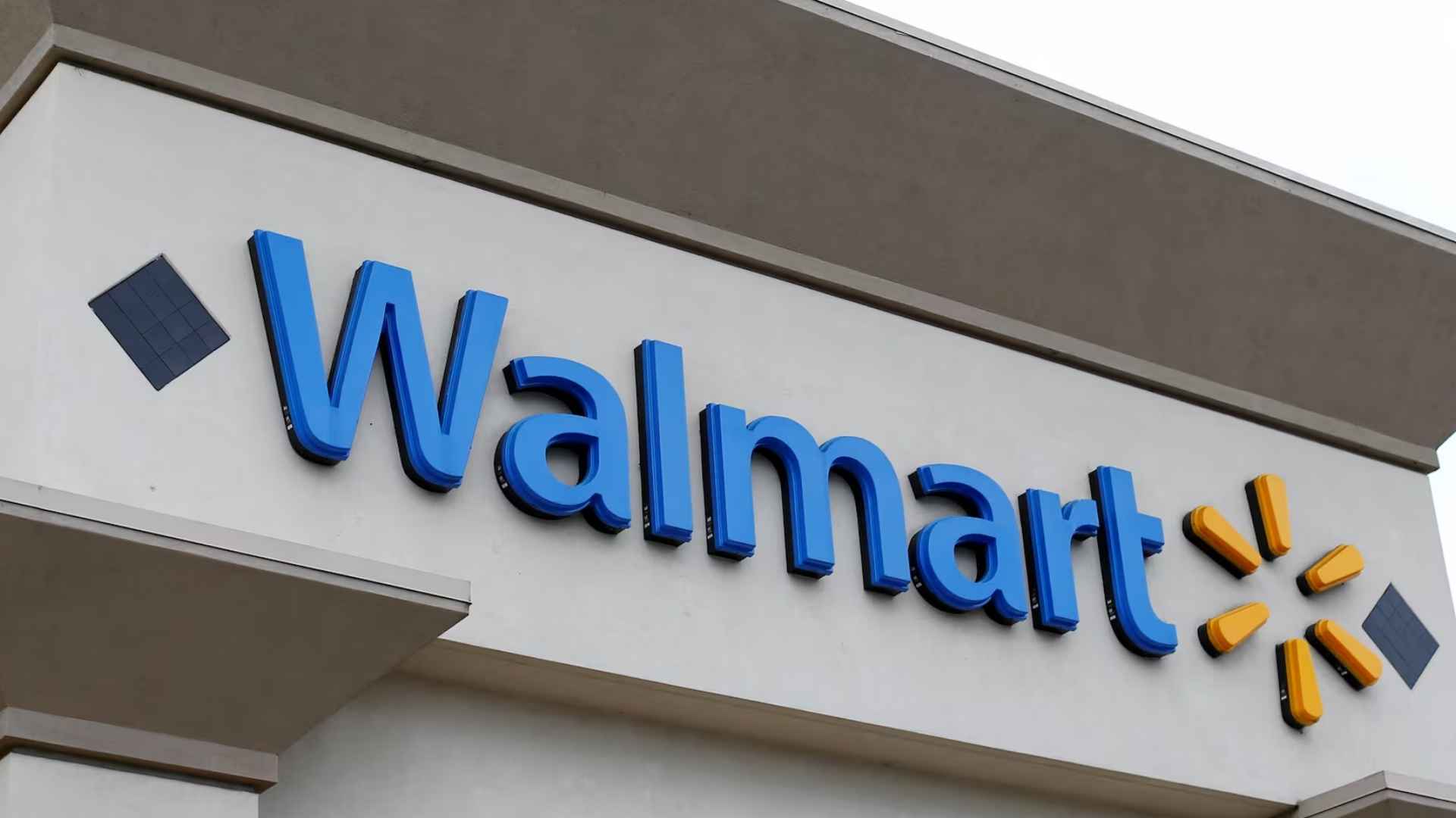 Blue Walmart sign on storefront highlighting retailer that reinstated $6.99 basket fee on SNAP and orders under $35 in 2025.