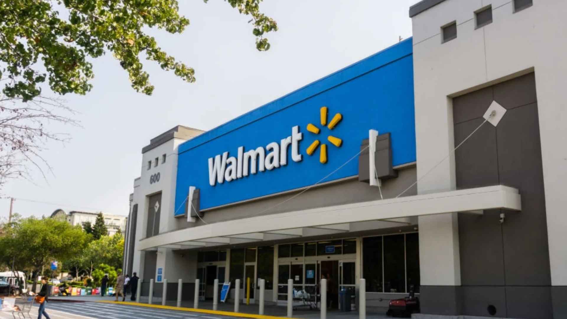 Exterior of a Walmart store highlighting upcoming 2025 price increases announced by CEO Doug McMillon.