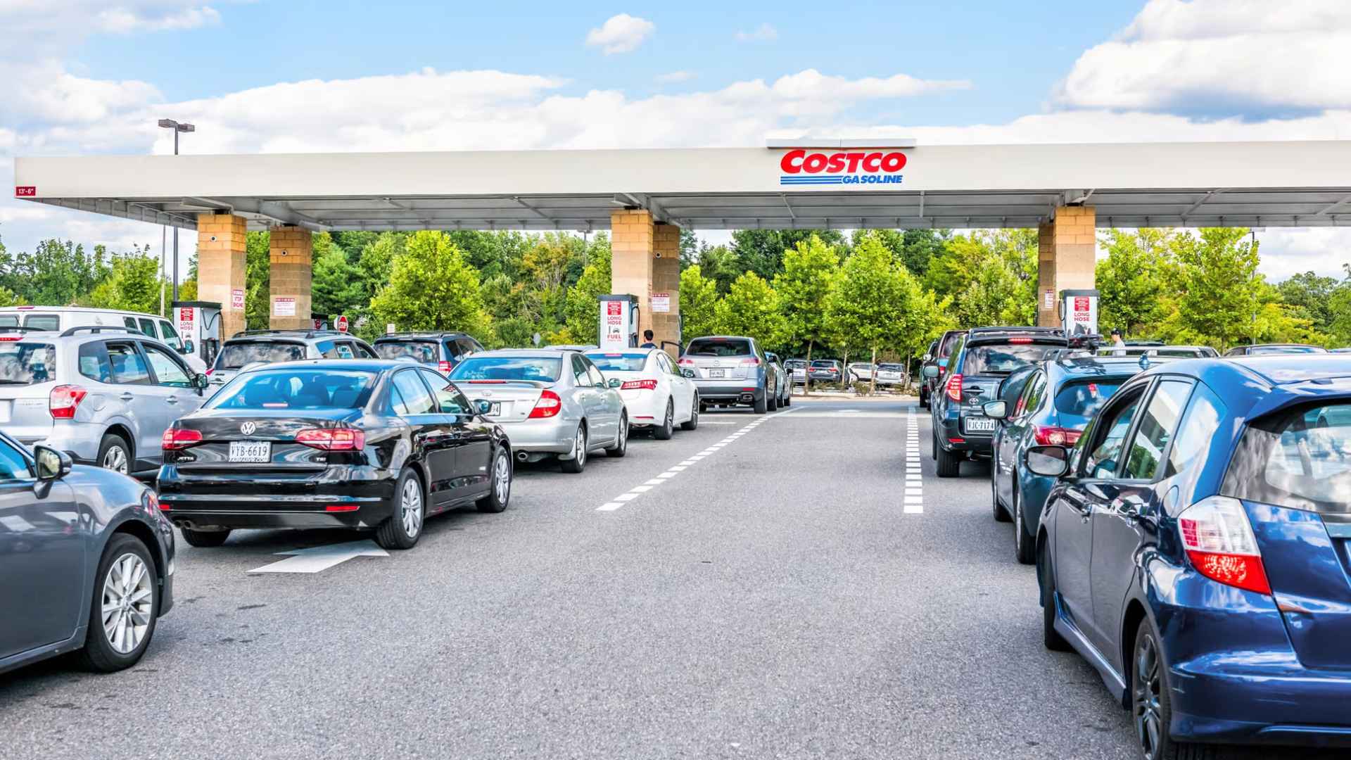Cars lined up bumper-to-bumper at a Costco gas station, illustrating long queues after stricter member-only fuel access rules.