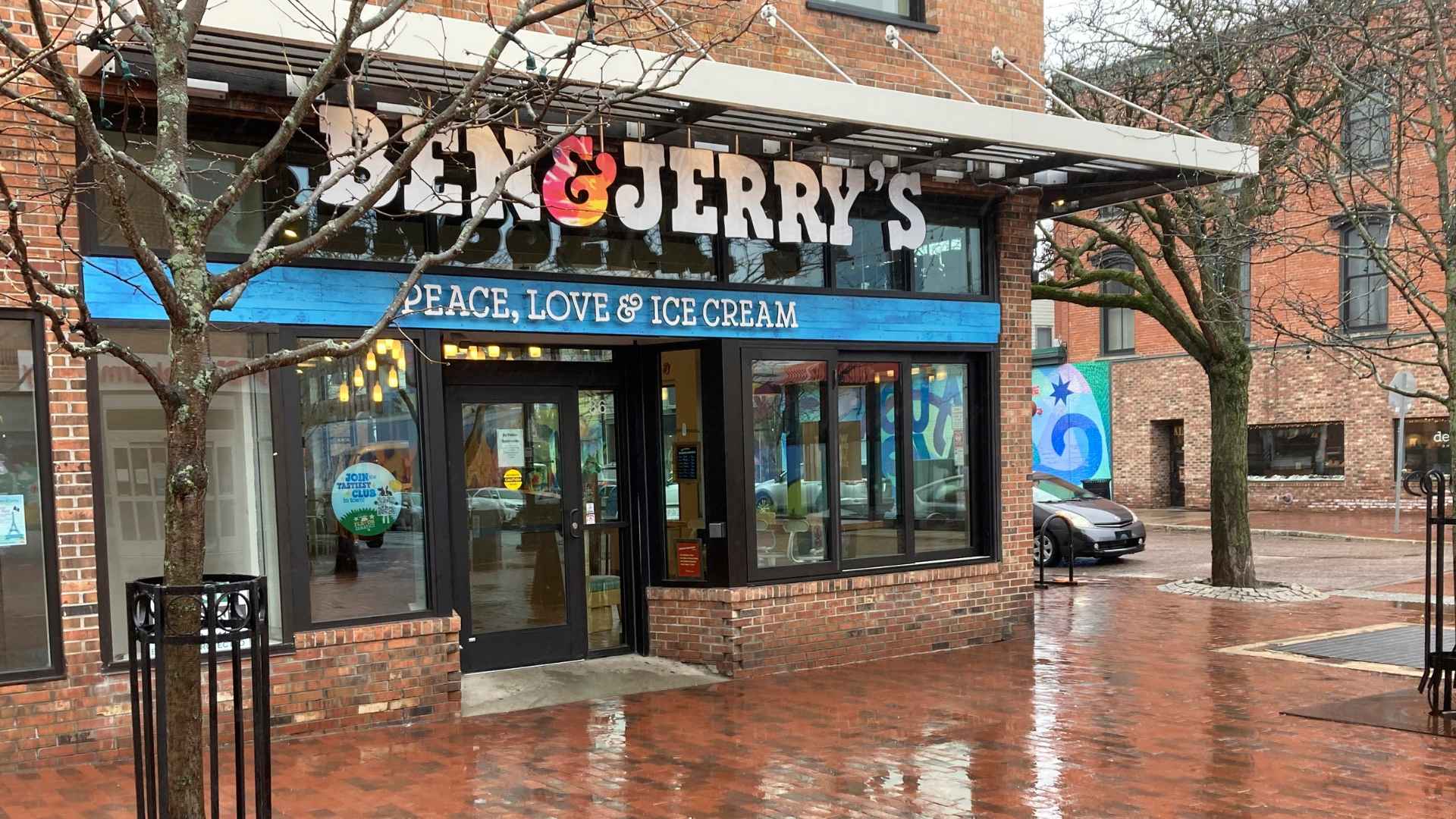 Ben & Jerry’s storefront with “Peace, Love & Ice Cream” sign as CEO faces potential firing for speaking out on social issues