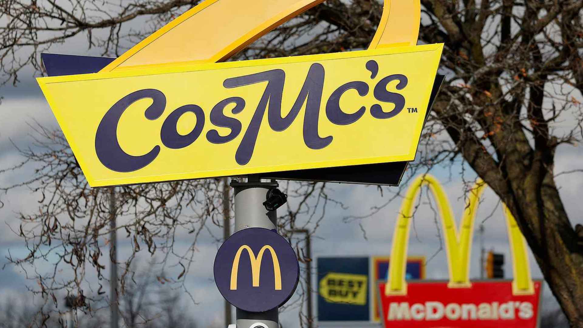 CosMc’s sign in front of McDonald’s golden arches; one of several pilot cafés set to close nationwide in June 2025.