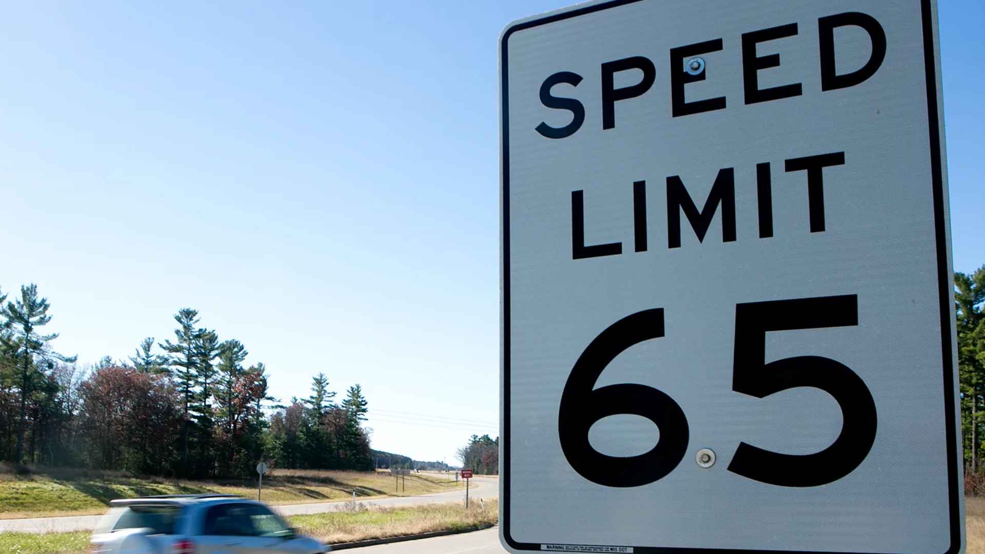 Indiana highway speed-limit sign displaying 65 mph, reflecting new July 1 2025 state law