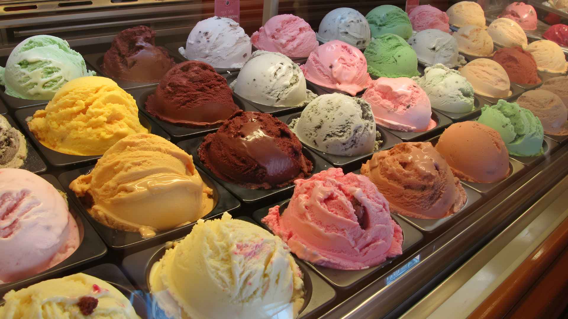 Sweet Bribery ice cream display featuring colorful pho-inspired, brisket, and classic flavors in Houston shop before closure
