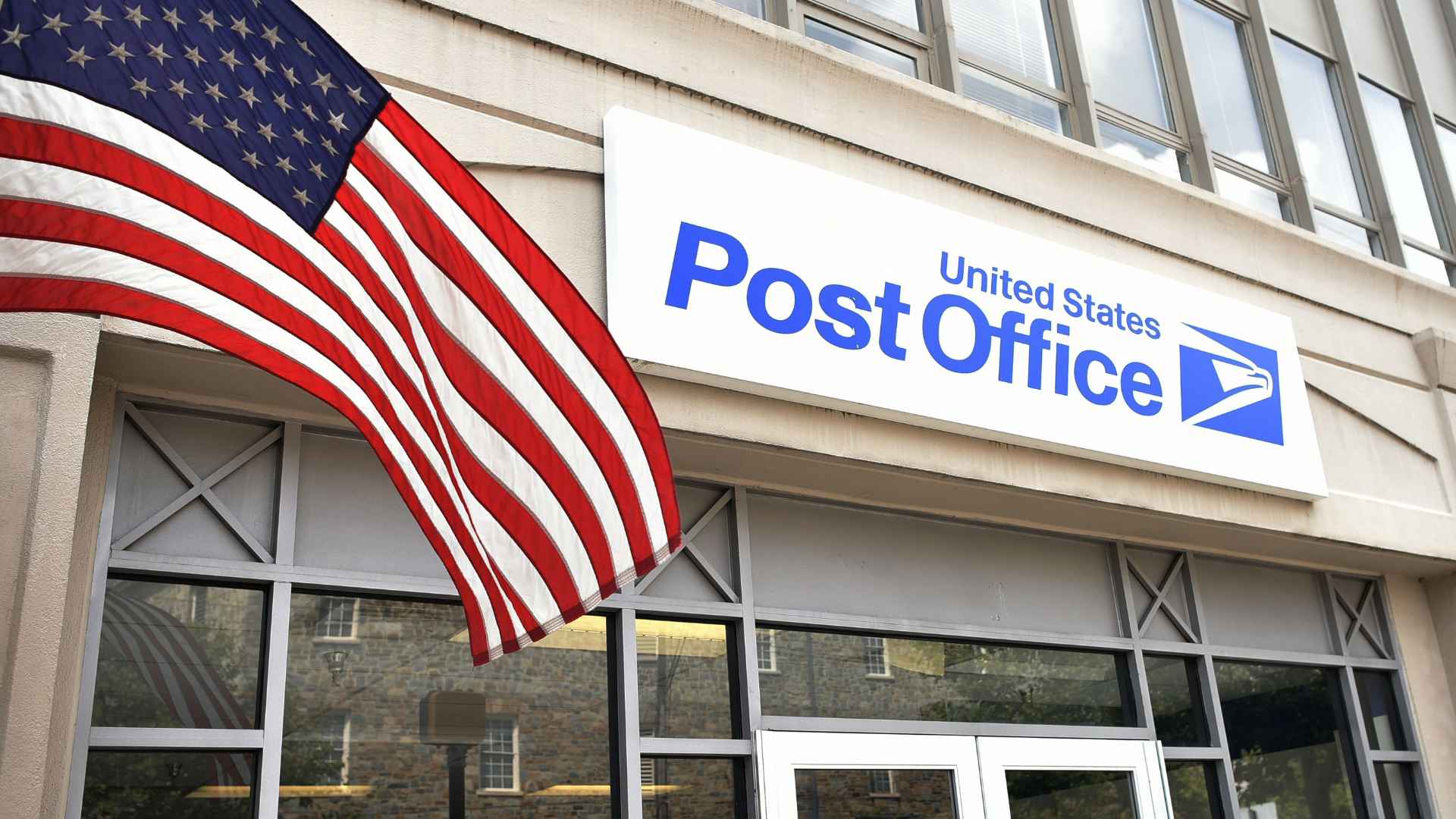 Exterior of a United States Post Office with an America