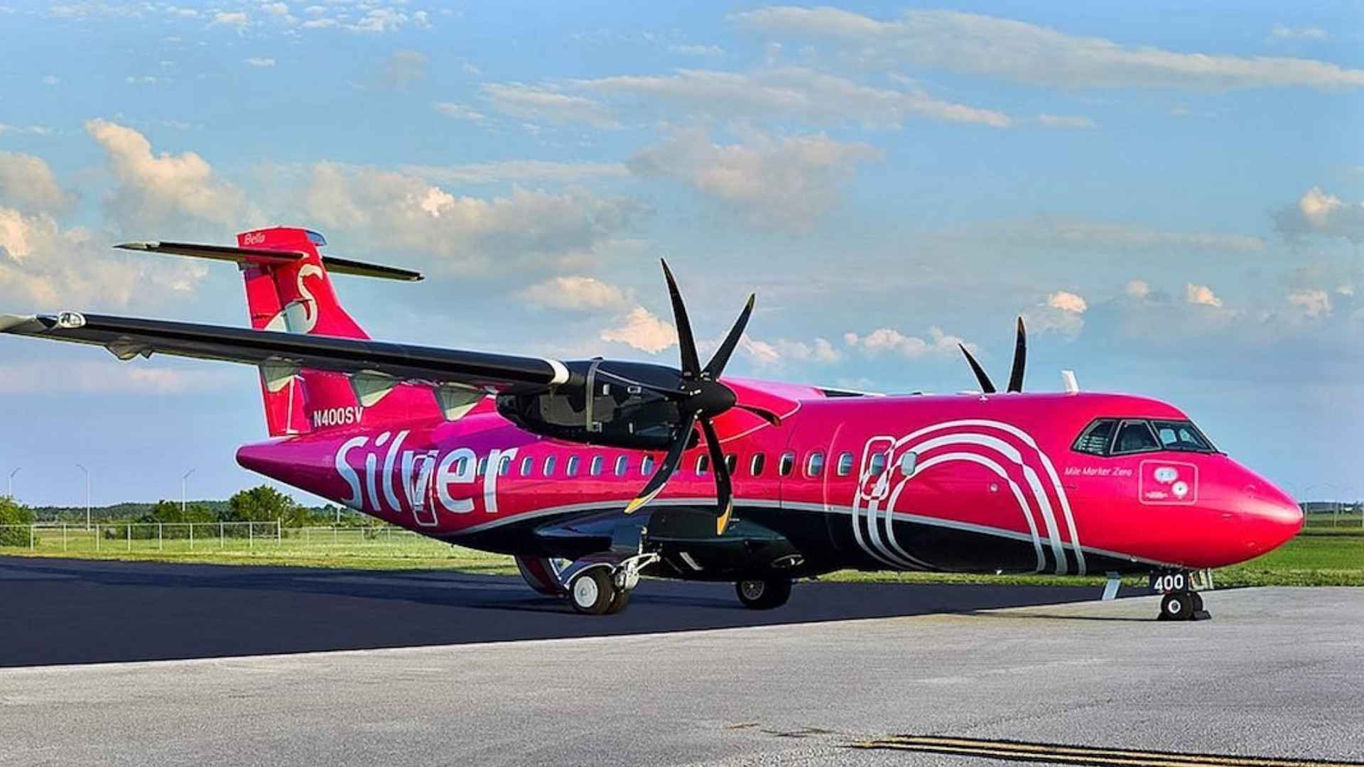 Silver Airways bright-pink ATR turboprop parked on the tarmac after bankruptcy grounds all Caribbean, Bahamas and Florida flights