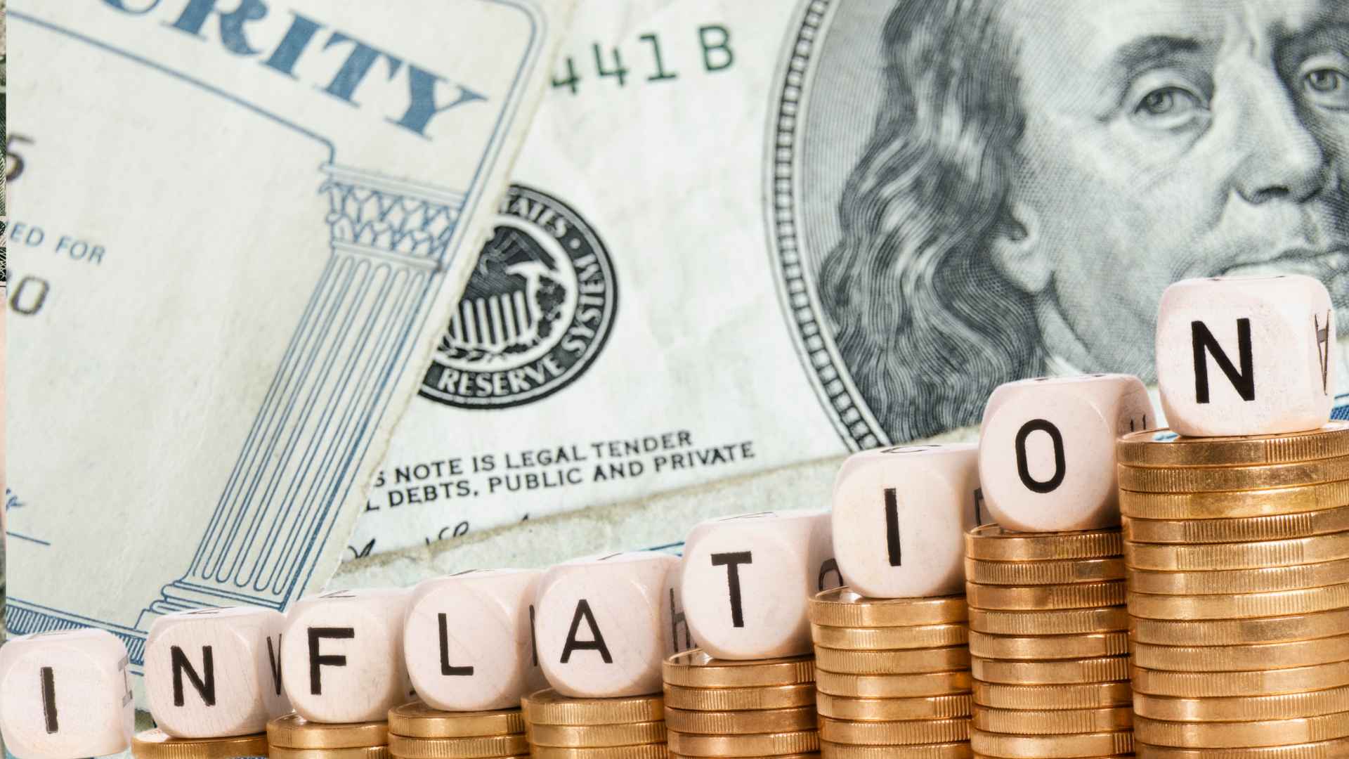 Stacks of coins spelling "INFLATION" in front of Social Security card and U.S. currency.