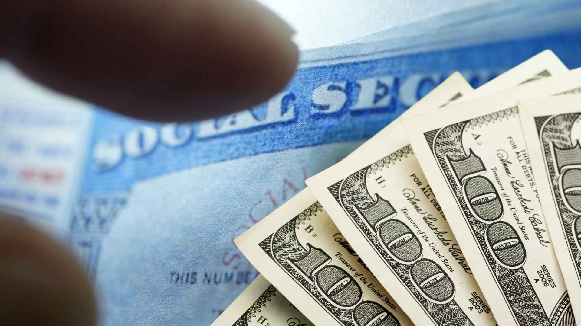Social Security card alongside several hundred-dollar bills, symbolizing SSA’s June 12 deposits for eligible beneficiaries.