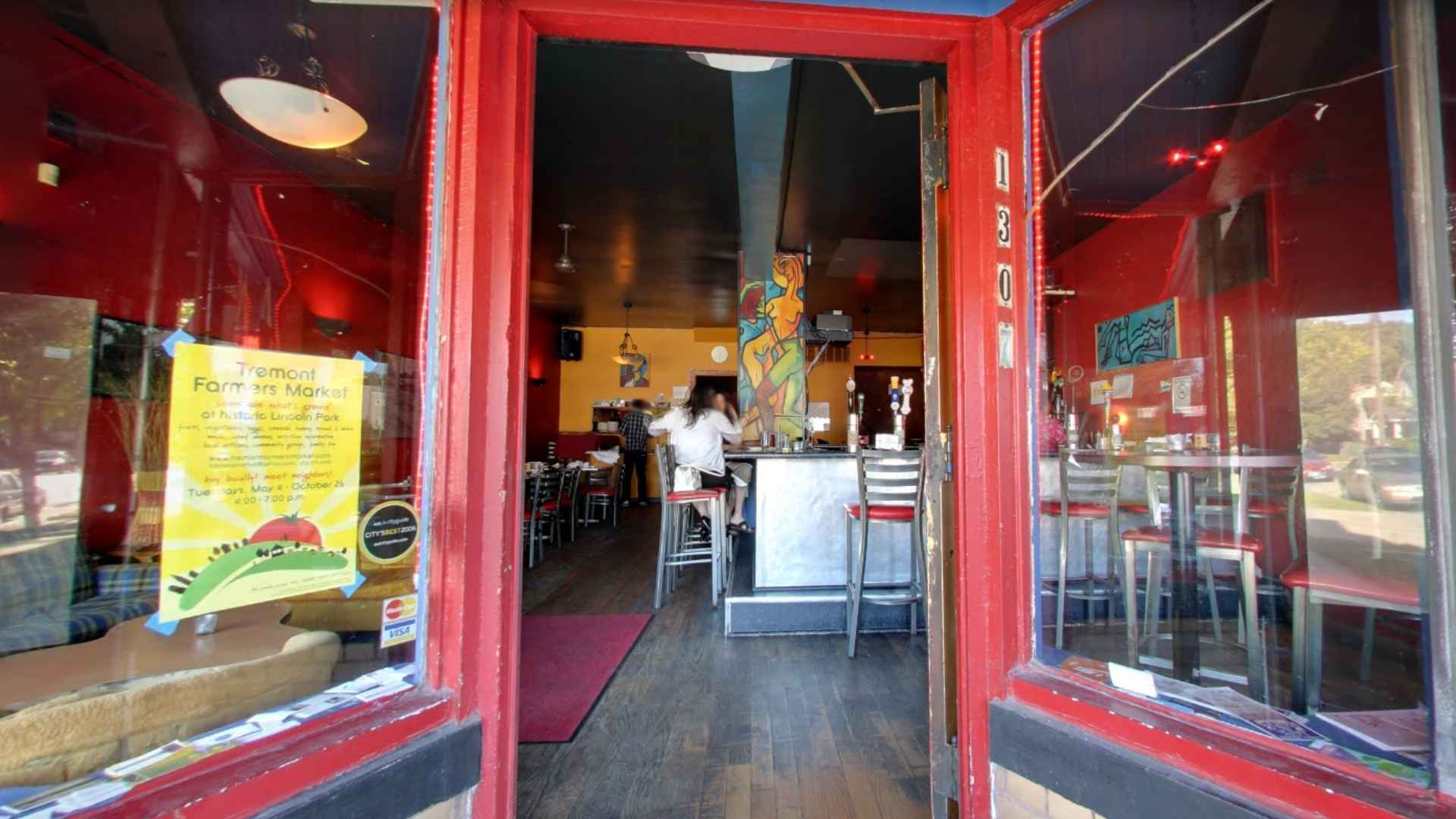View through the bright red entrance of Lava Lounge, 1307 Auburn Ave., revealing bar interior days before its farewell closure.