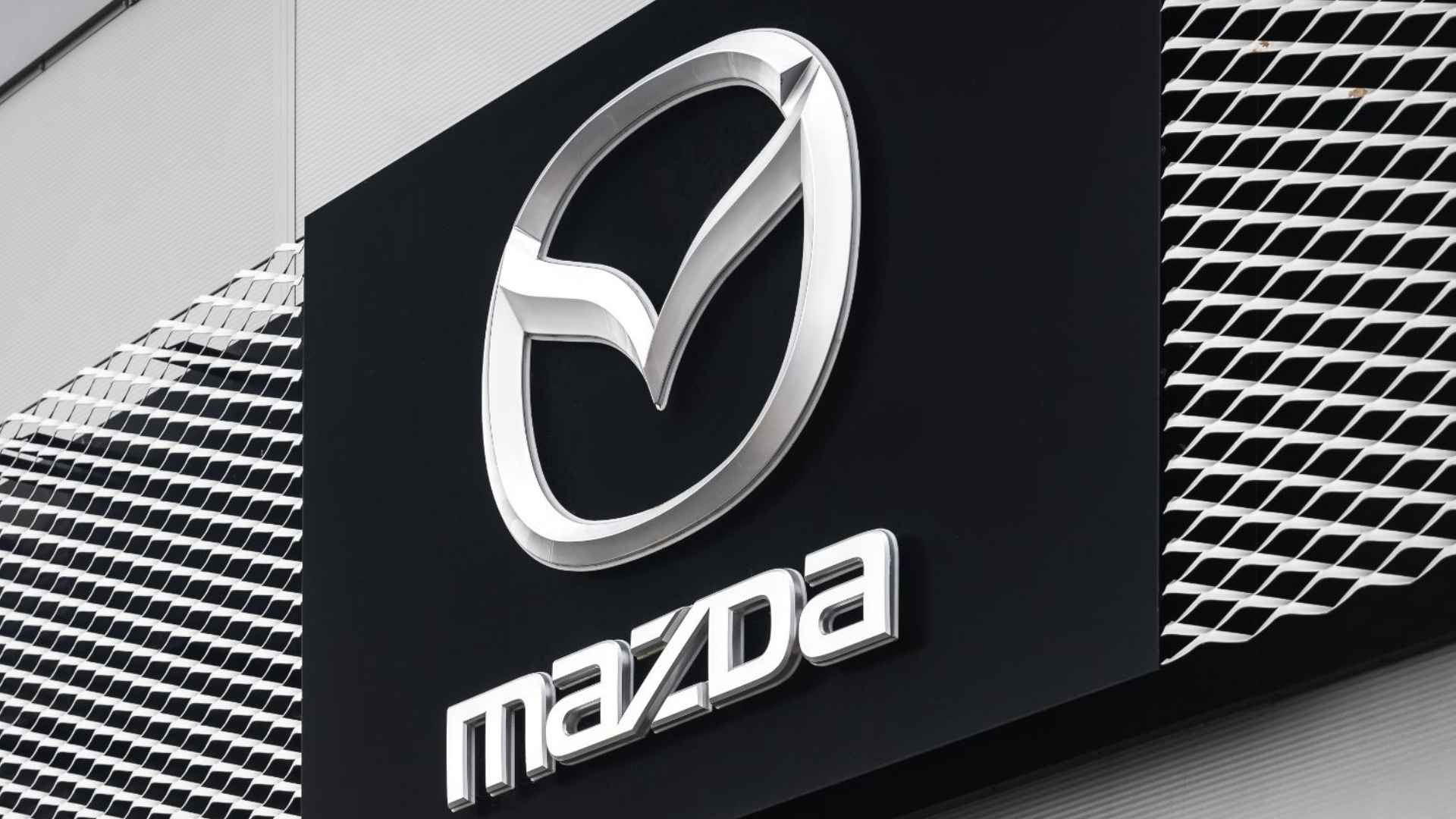 Mazda logo on dealership facade