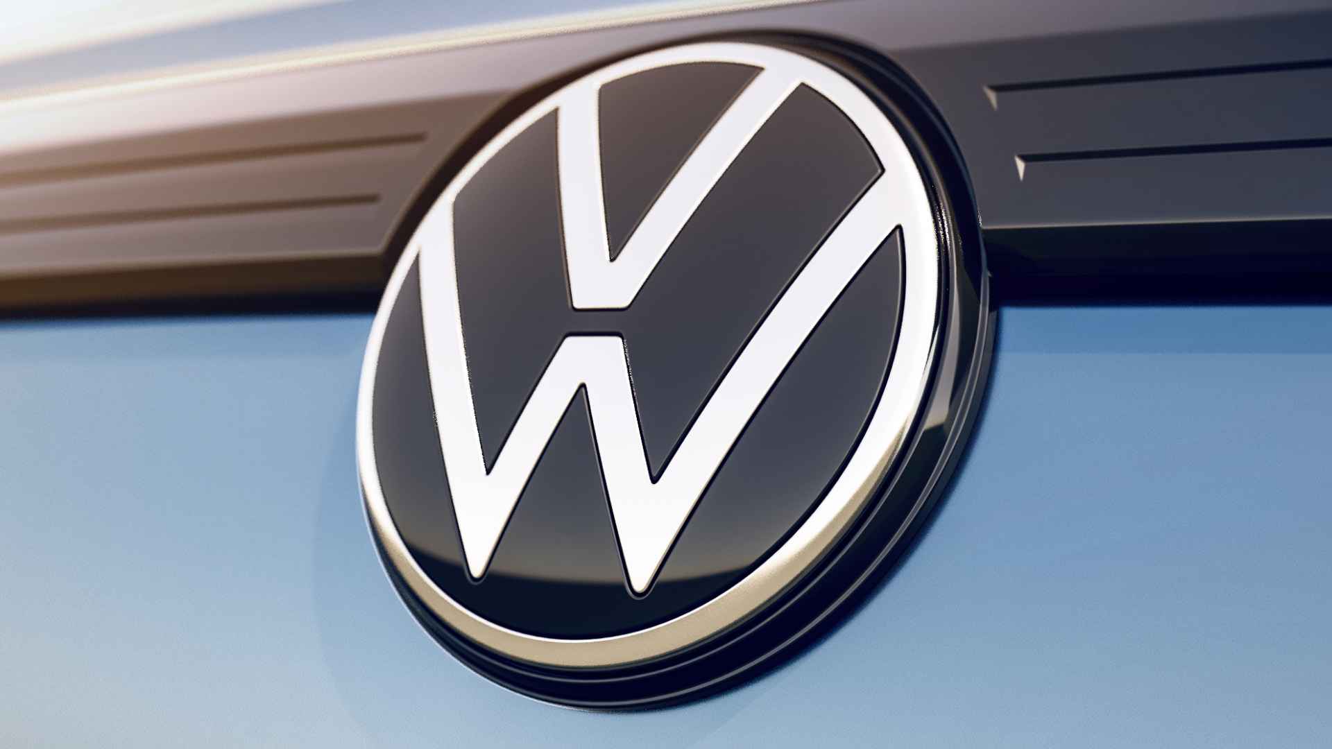 Volkswagen emblem on blue Atlas SUV, illustrating 2024-25 Atlas and Atlas Cross Sport rear-camera defect recall