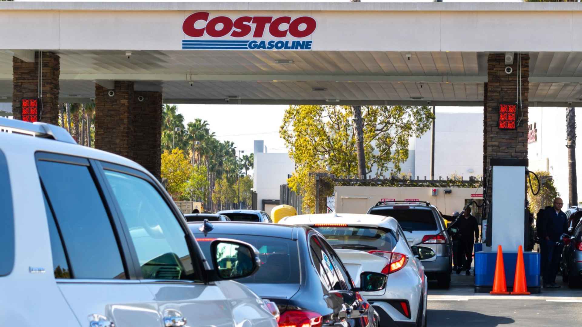 Cars queue at a Costco Gasoline pump, illustrating how Walmart, Costco, and Dollar General are expanding into U.S. fuel retail.