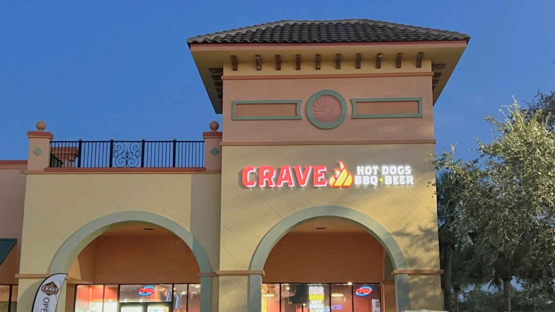 Exterior of Crave BBQ restaurant at Rolling Acres Plaza, closed after eight months of operation