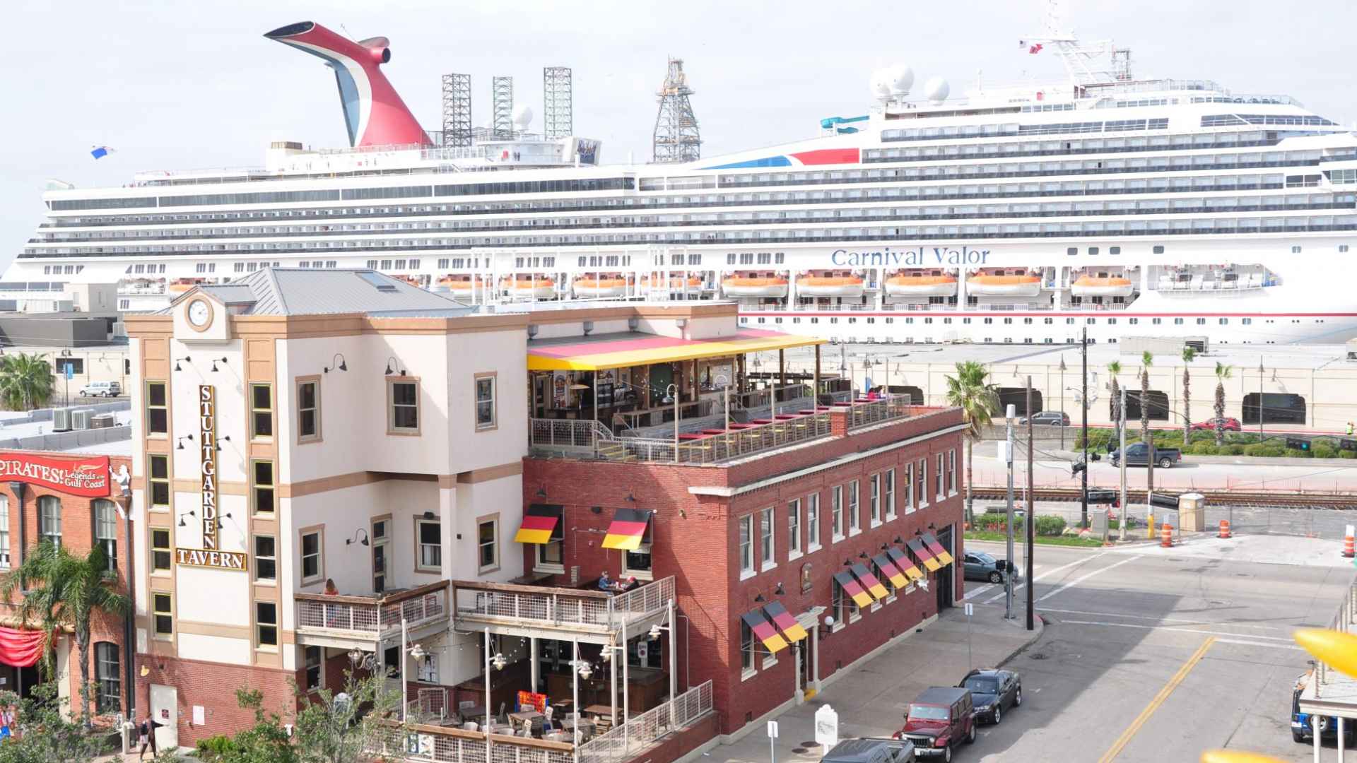 Stuttgarden Tavern rooftop beer garden in Galveston with Carnival cruise ship docked in the background