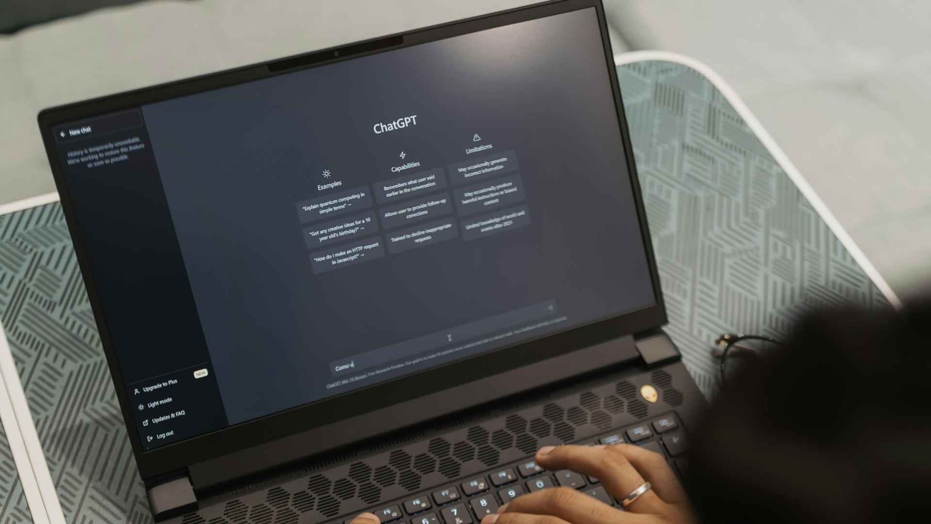Laptop screen showing ChatGPT conversation as girlfriend scrolls, uncovering boyfriend's secret getaway breakup plan
