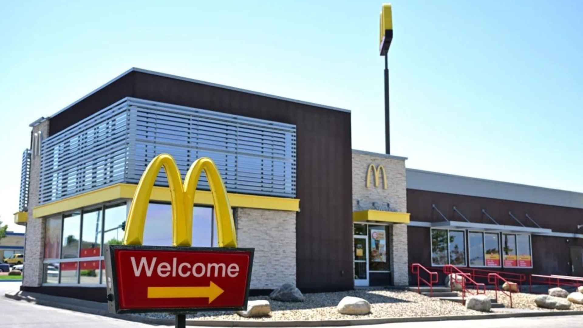 Exterior of a modern McDonald's restaurant with welcome sign, ahead of Krispy Kreme doughnut removal on July 2