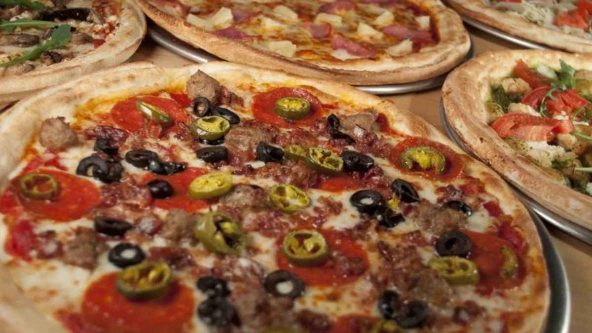 A selection of delicious pizzas from a local Ohio pizzeria, featuring pepperoni, sausage, and vegetables.