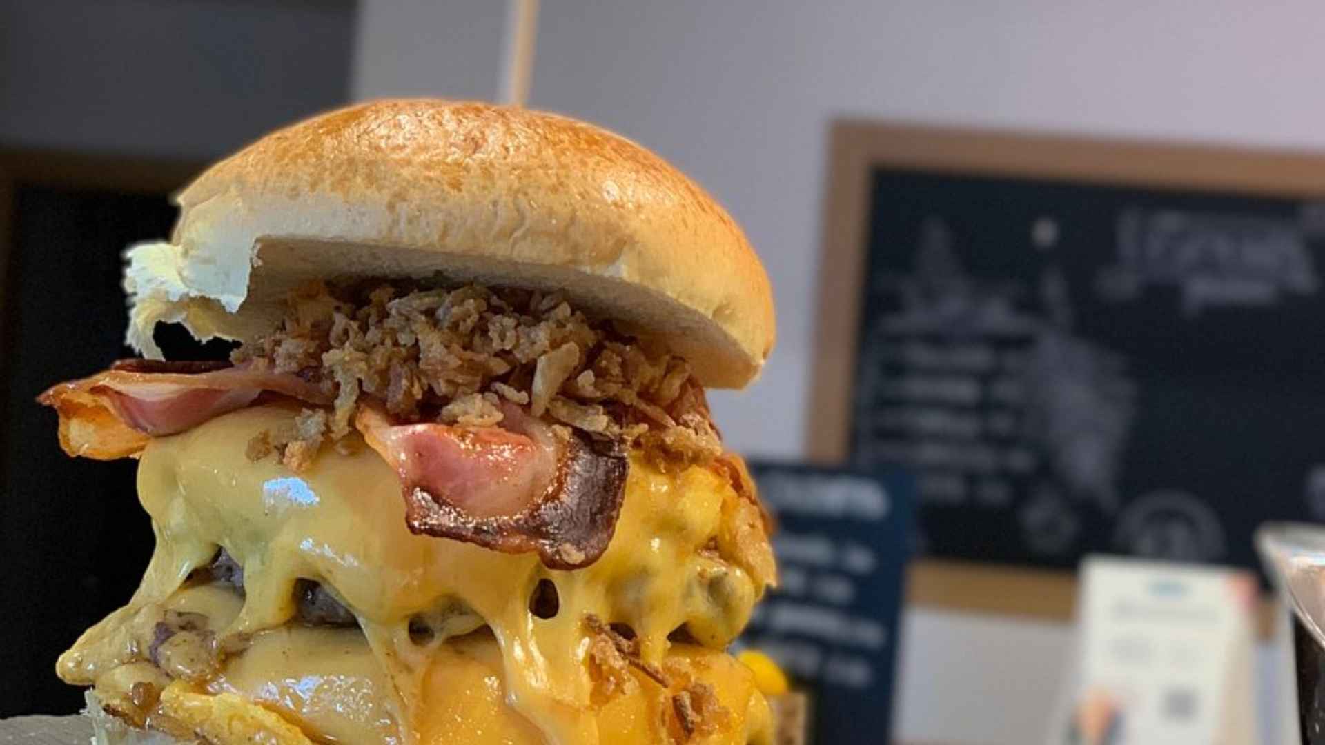 Cheesy double bacon smashburger served at Great Neck’s popular burger spot Kai Burgers and Dumplings