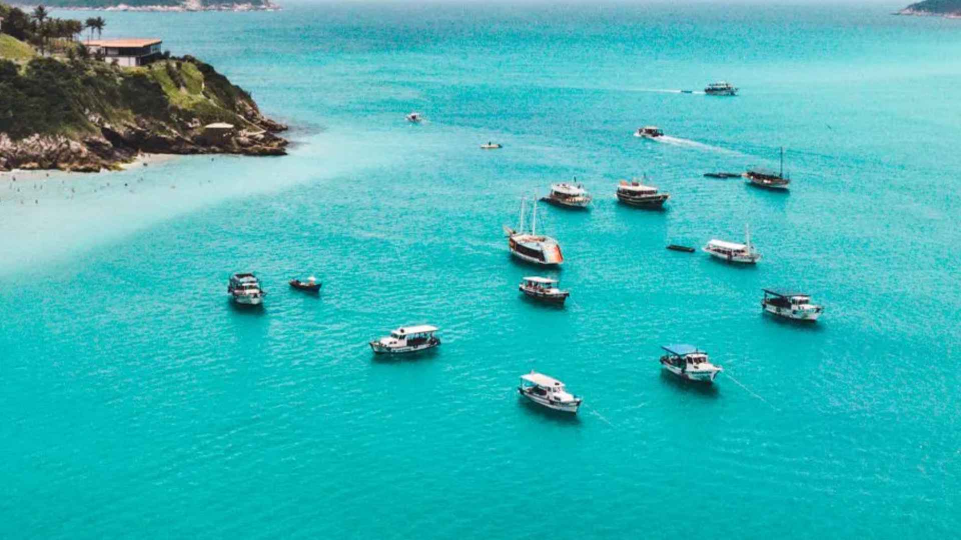 Aerial view of boats floating in clear turquoise waters near Madagascar, site of historic pirate shipwreck discovery
