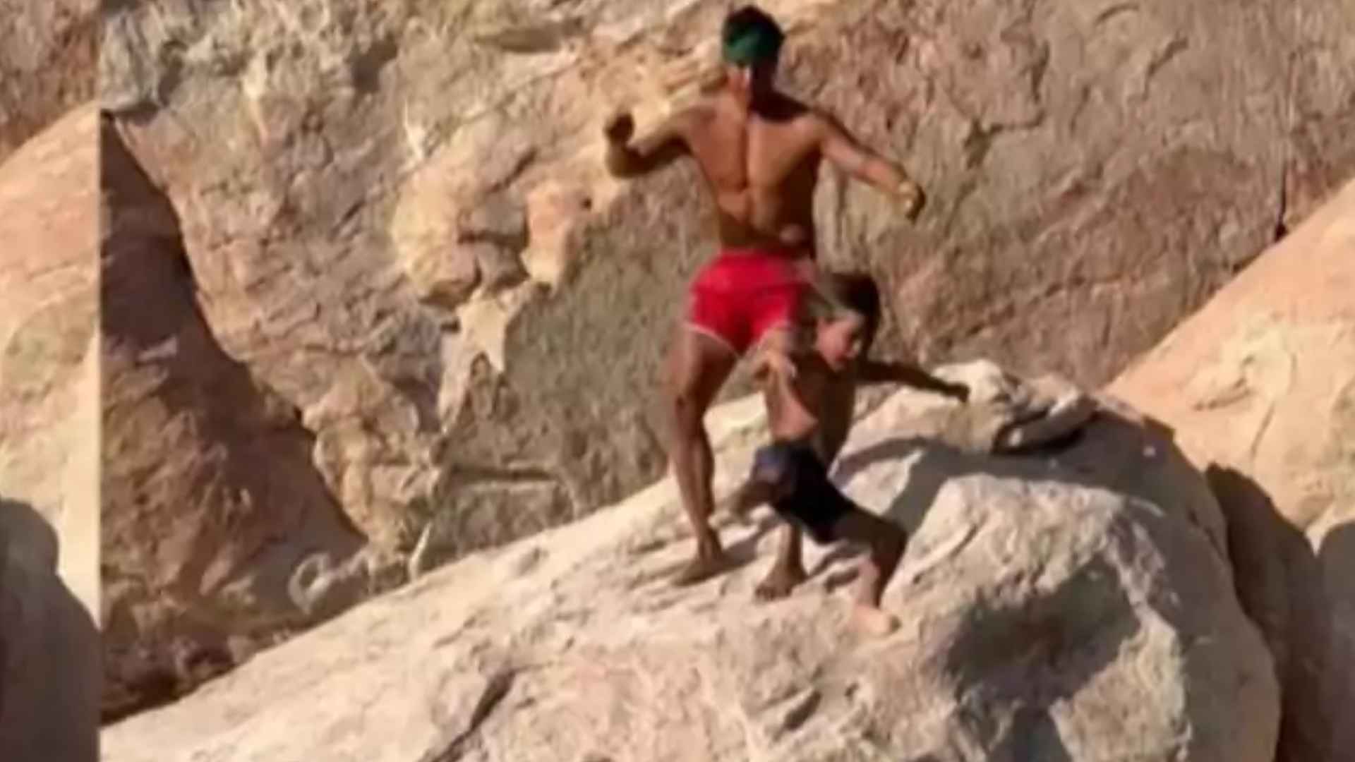Influencer Garrett Gee throws his son off cliff into water at Lake Powell to overcome childhood fears