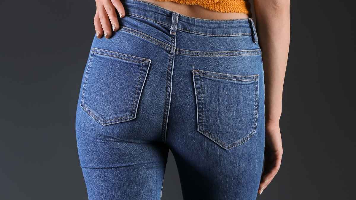 Woman wearing tight jeans illustrating risks of tight clothing on flights