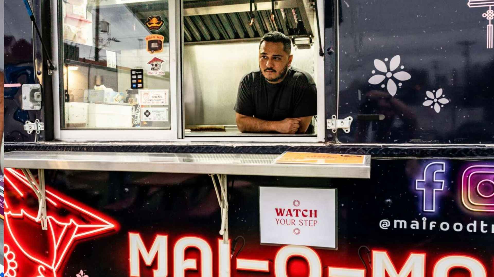 Chef Ivan Torres leaning out of the Mai O Mai food truck serving window at Tony’s Siesta on Brooklyn Avenue