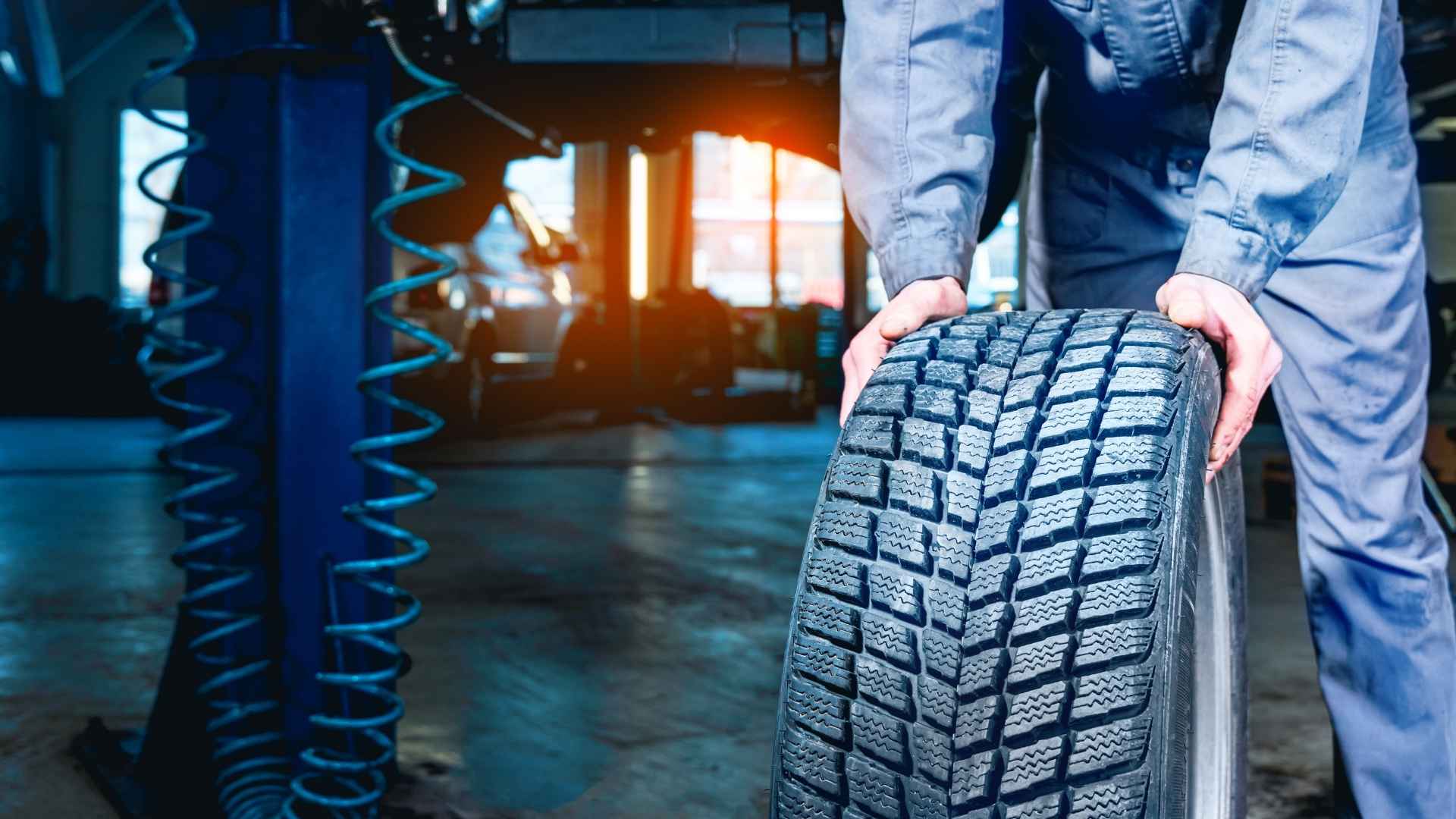 Mechanic inspecting used tire after buyer's Facebook Marketplace purchase flagged unsafe at Discount Tire