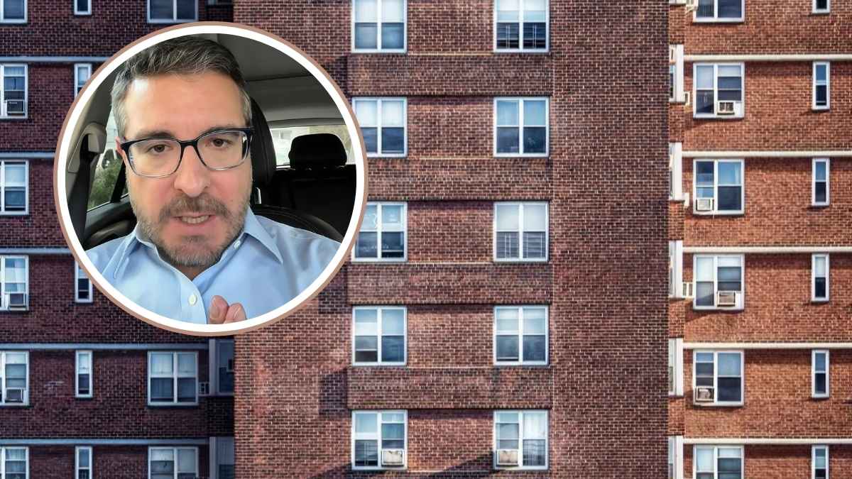 Fachada de edificio de viviendas de ladrillo rojo con múltiples ventanas, ilustrando pisos de 50.000 euros y riesgos de inversión inmobiliaria