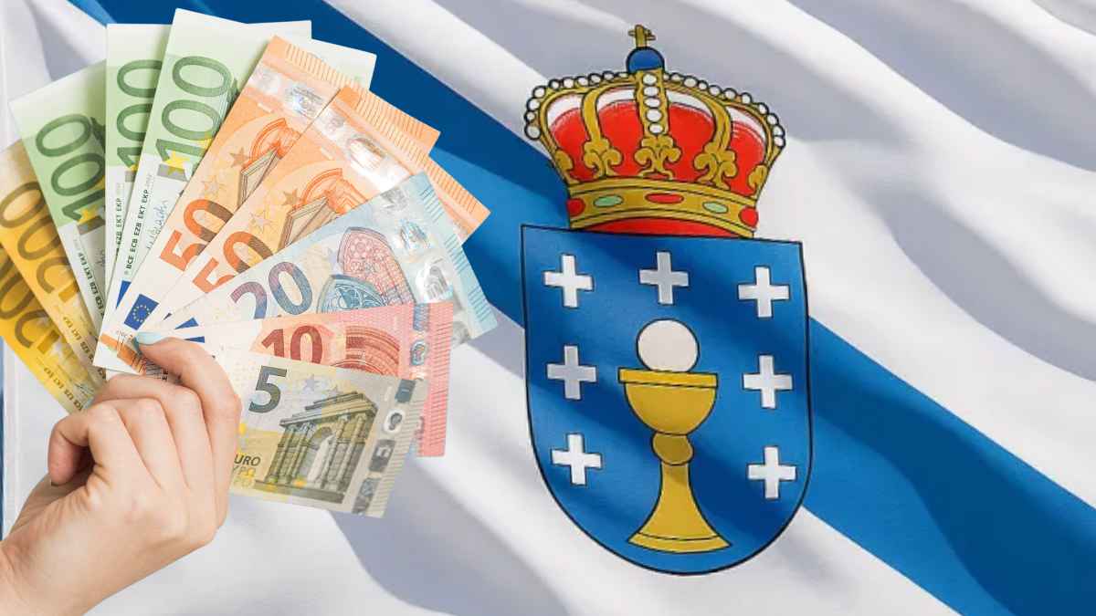 Mano sosteniendo billetes de euros junto al escudo de Galicia por la ampliación de la ayuda joven al alquiler
