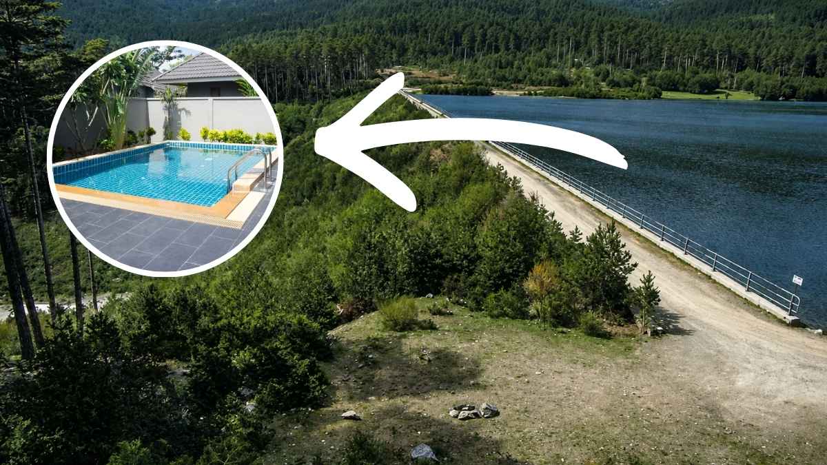 Presa de El Tejo en El Espinar junto al embalse rodeado de zona forestal